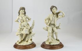 A Pair of Capodimonte Figures, Signed G. Berni - Of a Young Boy and Girl In 19th Century Dress.