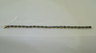 9ct Gold Tennis Bracelet Set With Blue Faceted Stones Between Clear Stone Spacers, Length 7.