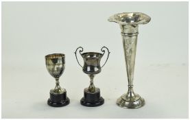 Two Small Silver Trophies, Together With a Silver Vase, Flared Rim, Tapering Body, Loaded Base.