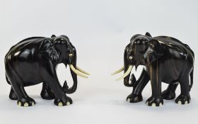 Pair Of Carved Hardwood Elephant Figures, Set With Ivory Tusks And Inlaid Feet.
