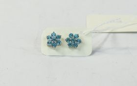 Paraiba Blue Topaz Pair of Floral Stud Earrings, each earring set with seven round cut,