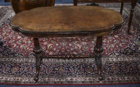 Victorian Walnut Centre Table Shaped Quatrefoil Table Top Raised On Two Turned Reeded And Carved