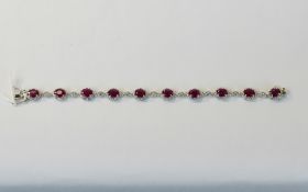 Ruby and White Topaz Bracelet, ten oval