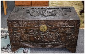 Early 20thC Chinese Camphor Chest profusely carved to hinged top and all four sides,