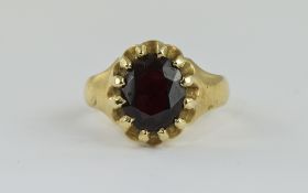 A 9ct Gold Gypsy Set Single Stone Garnet, The Faceted Garnet of Reasonable Colour and Clarity.