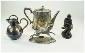 Silver Plated Teapot Together With A Plated Milk Jug, Cast Animal Stag And A Resin Blacksmith