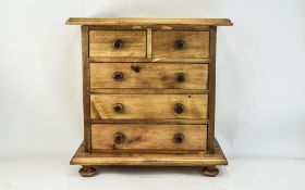 Miniature Chest Of Drawers Two Short over Three Long Drawers, Raised On Turned Feet.