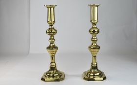 A Good Quality And Heavy Pair Of Diamond Cut Brass Candlesticks,