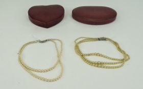 2 Fitted Boxes Containing A Double And Triple Strand Simulated Pearl Necklaces.