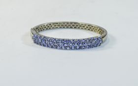 A Nice Quality Silver Set Tanzanite Hinged Bangle. Fully Hallmarked, Set with Over 50 Tanzanite's,