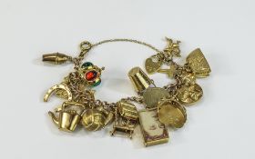 A Good Quality Vintage 9ct Gold Charm Bracelet with Chain and Padlock,