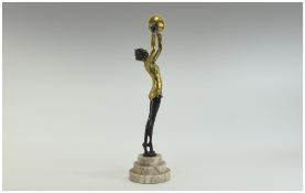 20thC Bronze Figure of A Young Woman arms outstretched holding a large golden ball.