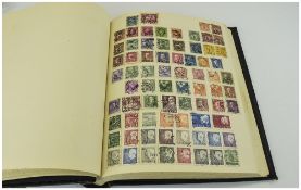 Black Spring Back Stamp Album, Well Stocked with Stamps From Around The World.