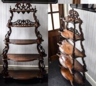 Victorian Walnut Five Tier Whatnot of shaped form, with carved scroll supports and molded edge.