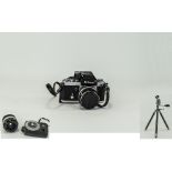 A Japanese Nikon Camera together with a selection of lenses,