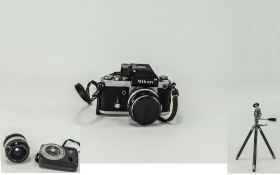 A Japanese Nikon Camera together with a selection of lenses,