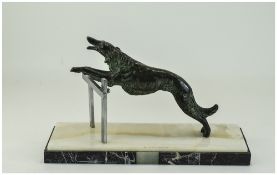 Art Deco Bronze Figure of a Dog Leaping Over a Fence, Raised on a Black and White Marble Effect