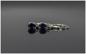 Sapphire Drop Earrings, oval cut solitaire sapphires, totalling 1.5cts, set in silver lever back