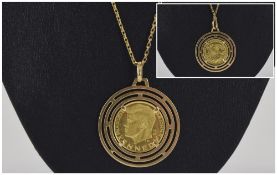John F. Kennedy Gold Coin/ Medal Within a pendant mount- marked 750. Coin stamped 900 fine gold.