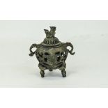 Oriental Bronzed Archaic Censer And Cover, Twin Handled Raised On Trefoil Base And Foo Dog Finial.