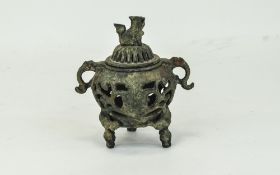 Oriental Bronzed Archaic Censer And Cover, Twin Handled Raised On Trefoil Base And Foo Dog Finial.