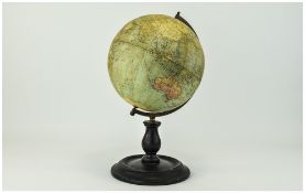 Phillips 9 Inch Terrestrial Globe brass mount with turned wooden base. Early to Mid 20thC.
