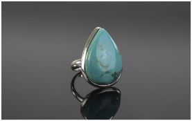 Silver Dress Ring set with a pear shaped turquoise stone. Stamped 925.