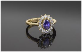 Ladies Amythist Dress Ring, central Amythist surrounded by clear faceted stones. Unmarked.