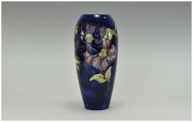 Moorcroft - Impressive Tall Vase ' Clematis ' Design on Blue Ground.