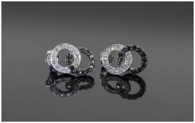 Pair of 9 Carat White Gold Stud Earrings set with black and white diamonds.