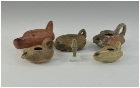 Collection Of Five Romanesque Terracotta Oil Lamps Together With A Roman Stone Amulet