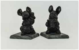 Pair of Black Pendelfin Book Ends inscribed 'Made in Wales' JWH Pendelfin, raised on marble bases.