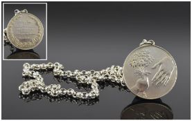 A Silver Peace Medallion Attached to a Silver Belcher Chain. Fully Hallmarked. 22 Inches In Length.