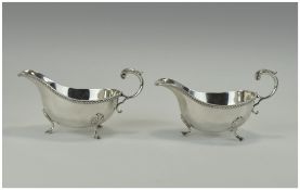 Elizabeth 2nd Fine Pair of Silver Sauce Boats. With reeded boarders and shell and hoof feet.