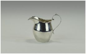 Victorian Silver Cream Jug of plain form with reeded border. Hallmark Birmingham 1865.