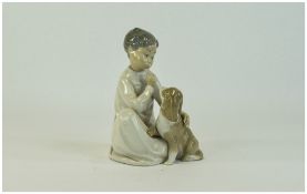 Lladro Figure ' Boy with Dog ' Model Num 4522. Issued 1970 - 1997. Height 7.5 Inches.