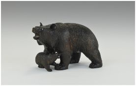 A Black Forest Type Carved Mother Bear and Cub with Bead Eyes. 8 Inches long.