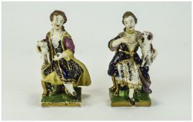 Bloor Derby Pair of Seated Figures, the lady holding a dog, the gentleman, a cat,