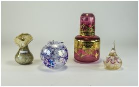 Four Pieces Of Coloured Art Glass, Comprising A Red Decanter With Gilt Decoration, Globular Candle