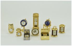 A Collection of Well Made and Heavy Gold Plated Miniature Clocks, various subjects and sizes. All in