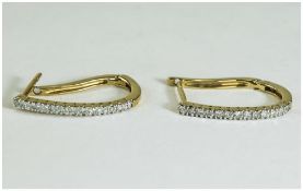 Pair of Ladies 9 Carat Gold Stylised Hoop Earrings set with round cut diamonds.