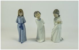 Nao by Lladro Figures ( 3 ) In Total. A Boy and Girl In Nightdress's. 9.25 - 9.