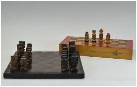 Early to Mid 20thC African Chess Set, carved wood pieces with matching carved board.