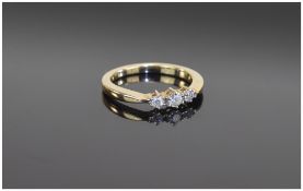 18 Carat Three Stone Diamond Ring set with round brilliant cut diamonds. Unmarked, tests 9 carat.