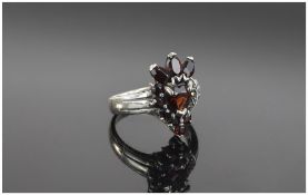 Silver Dress Ring set with garnets.
