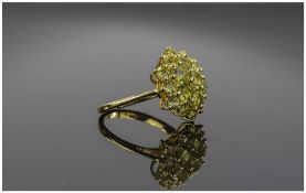 Peridot Cluster Ring, two tiers of round cut peridots surrounding a central similar stone, forming a