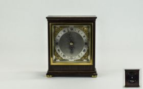 Elliot Mantel Clock with Silvered Chapter Ring, Ornate Fingers, Raised on Four Ball Feet.