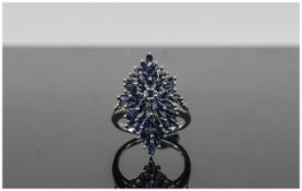Sapphire Cluster Ring, 4.8cts of marquise cut blue sapphires, centred by a similar round cut,