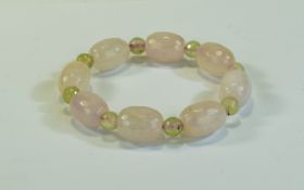 Rose Quartz and Prehnite Bracelet, faceted ovoid beads of rose quartz interspaced with small round