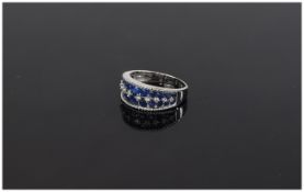 Sapphire and White Zircon Band Ring, two rows of graduated, round cut, blue sapphires,